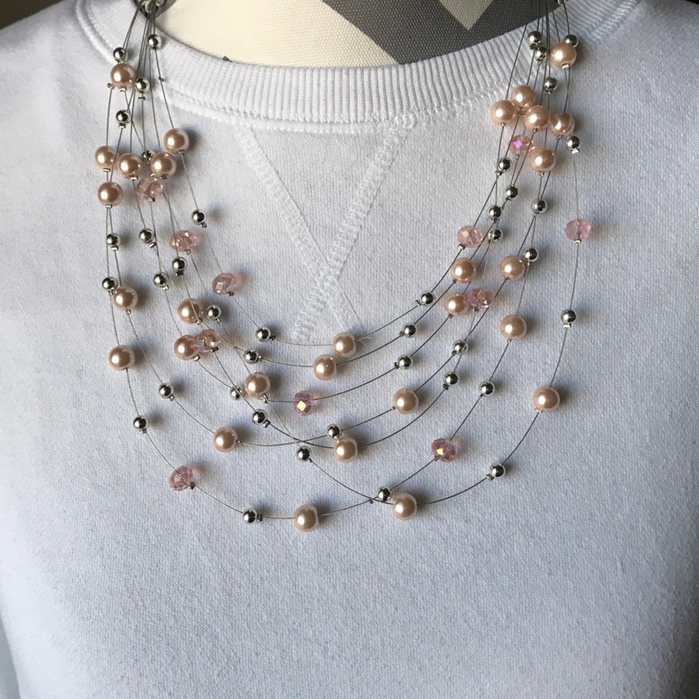 Rose gold and silver “pearl” necklace.
